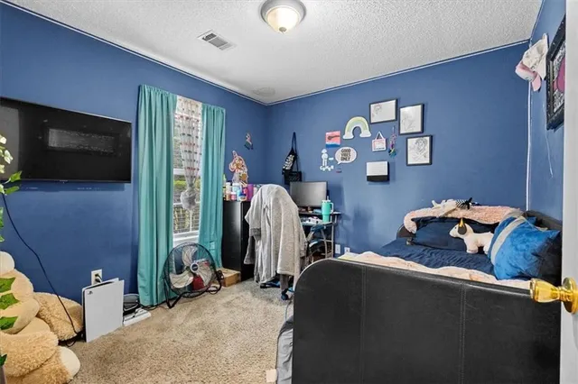 a room with furniture and a flat screen tv