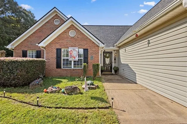 a front view of a house with a yard