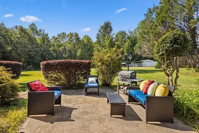 a view of outdoor dining space with a patio