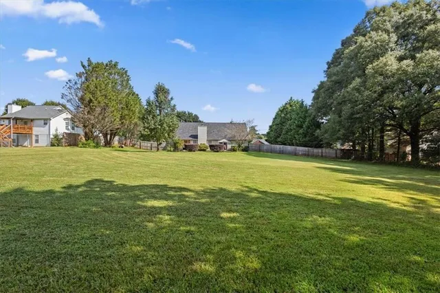 a view of a house with a big yard
