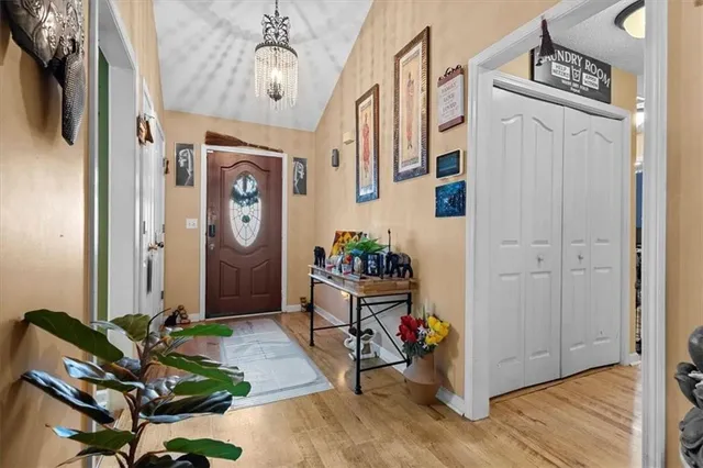 a view of an entryway with wooden floor