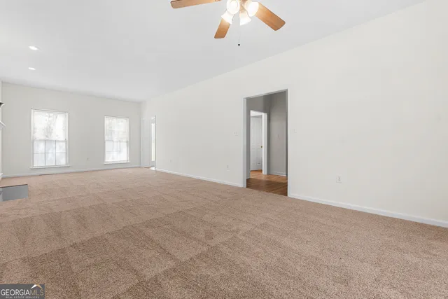 a kitchen with granite countertop a sink cabinets and window