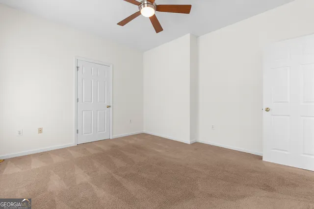 a white bath tub sitting next to a window