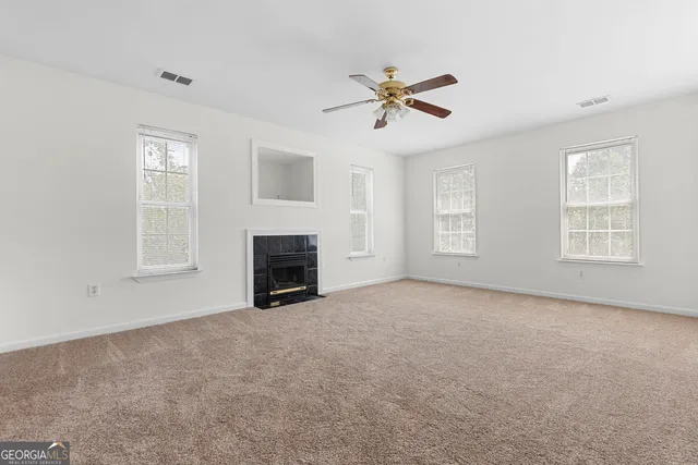 a bathroom with a toilet sink vanity tub and shower