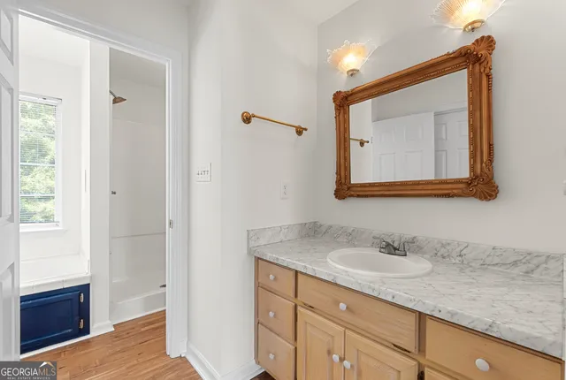 a view of a big room with closet and a ceiling fan