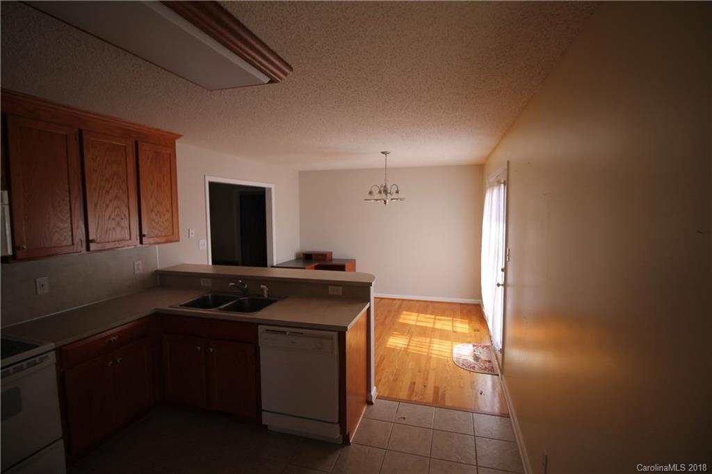 1215 Micol Road Newton, NC 28658 - Photo 5 of 12 a kitchen that has a sink and a stove