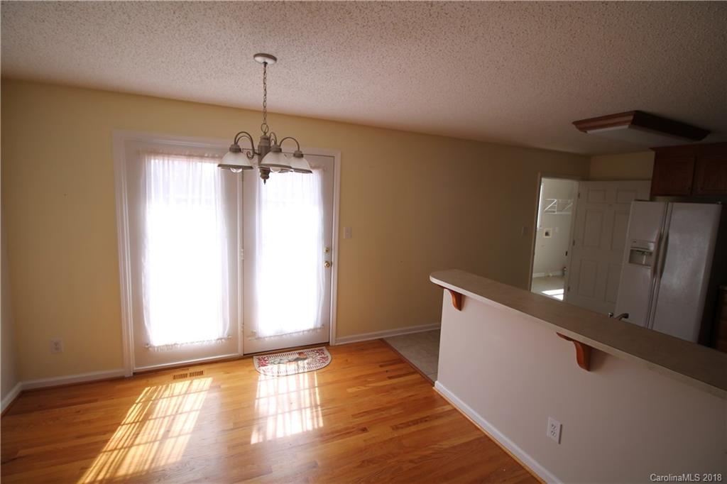 1215 Micol Road Newton, NC 28658 - Photo 6 of 12 a view of a room with wooden floor and windows