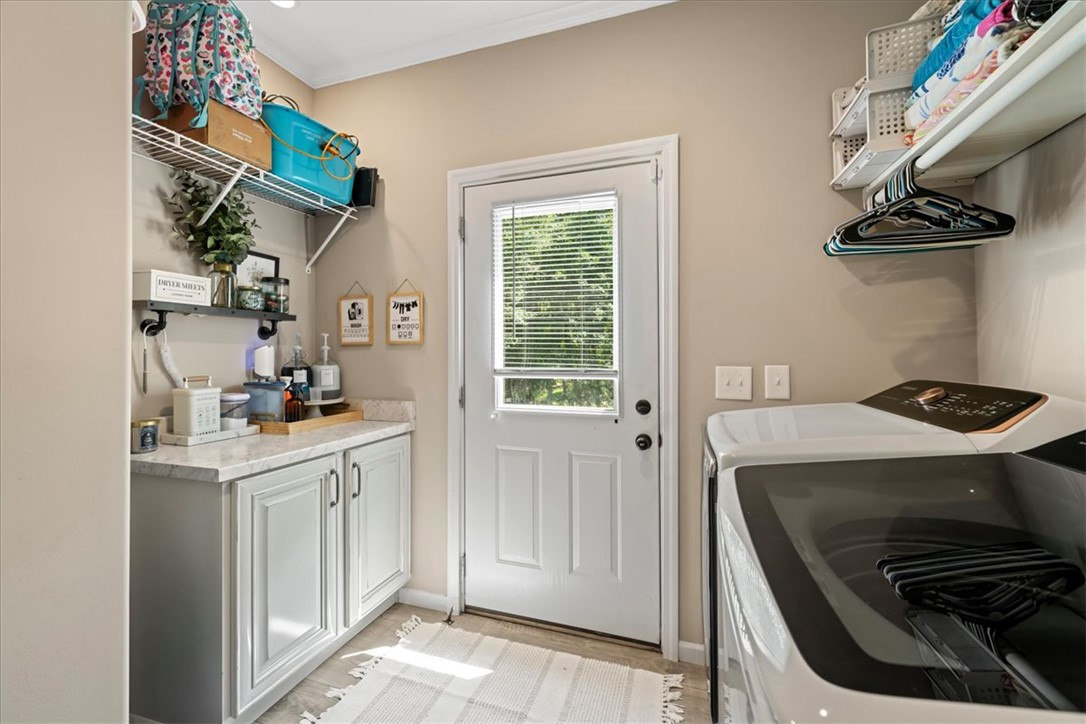 116 Parkview Road Iva, SC 29655 - Photo 34 of 44 A well-appointed utility room features a functional countertop and overhead storage solutions.