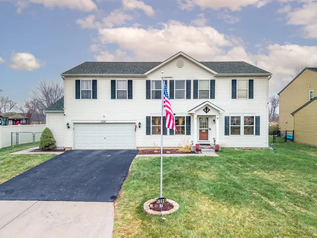 a front view of a house with a yard and porch