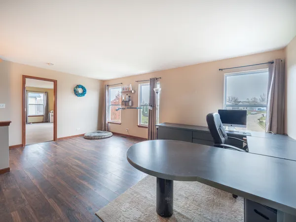 a view of kitchen with furniture and wooden floor