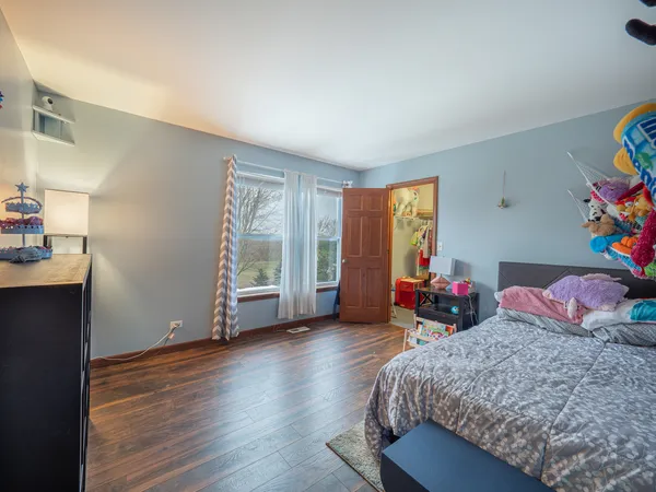 a bed room with a bed and a window