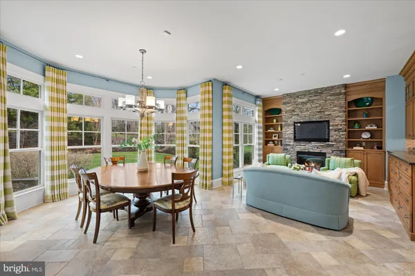 a view of a livingroom with furniture window and wooden floor