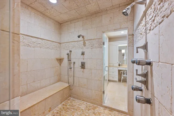 a bathroom with a shower and toilet