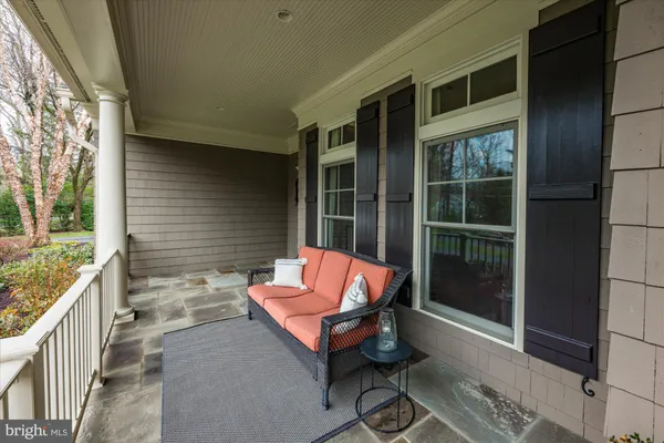 a backyard of a house with outdoor seating