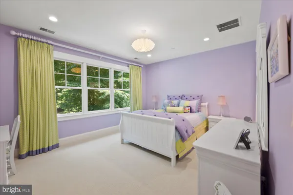 a bed room with a bed and a window