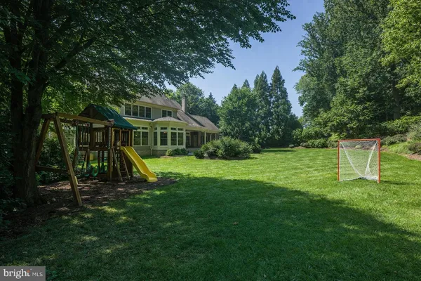 a view of a house with a park