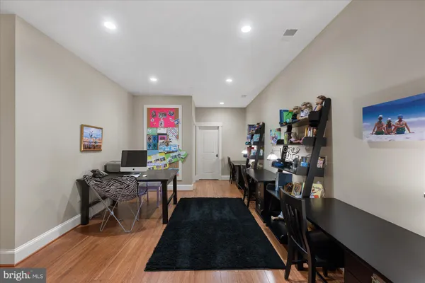 a spacious bedroom with a bed and a large window