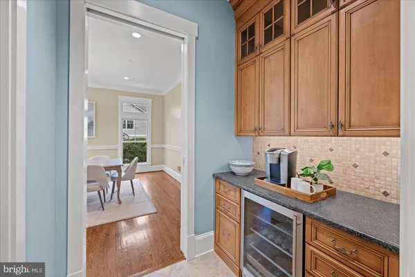 a kitchen with stainless steel appliances granite countertop a sink a stove and cabinets
