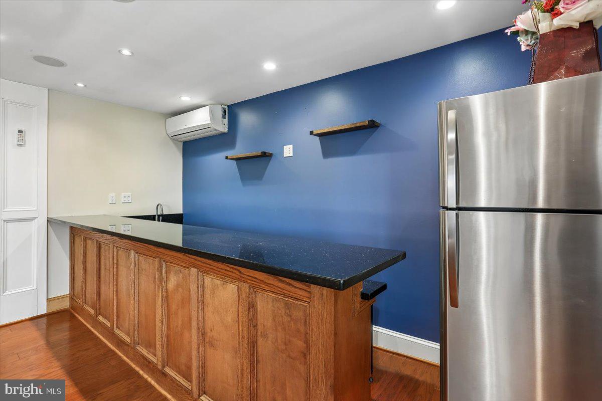 3709 Kenway Street Silver Spring, MD 20906 - Photo 10 of 34 a blue refrigerator freezer sitting inside of a kitchen