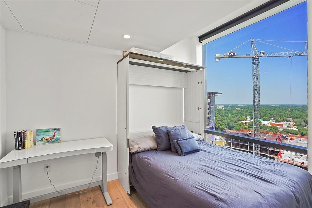 70 Rainey Street, Unit 1409 Austin, TX 78701 - Photo 18 of 38 Bedroom with wood finished floors and recessed lighting