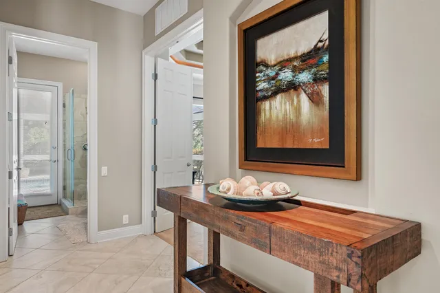 an aerial view of residential houses with outdoor space and lake view