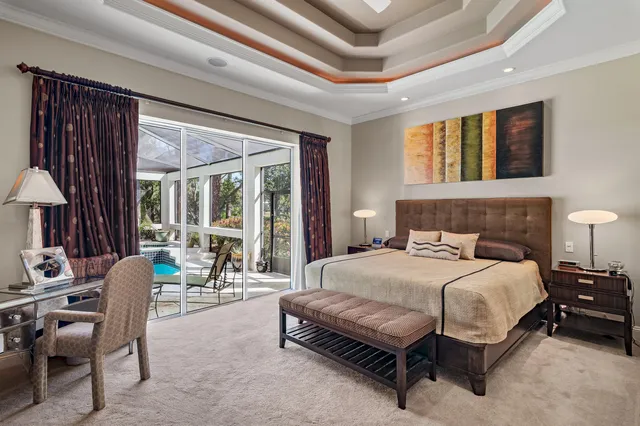 a aerial view of a house with a yard and potted plants