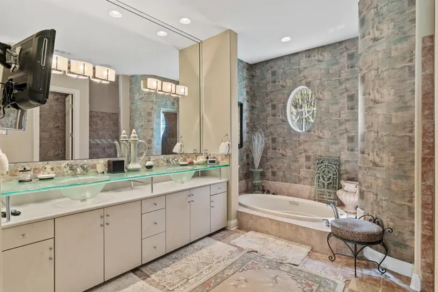 a view of a big house with a big yard and large trees