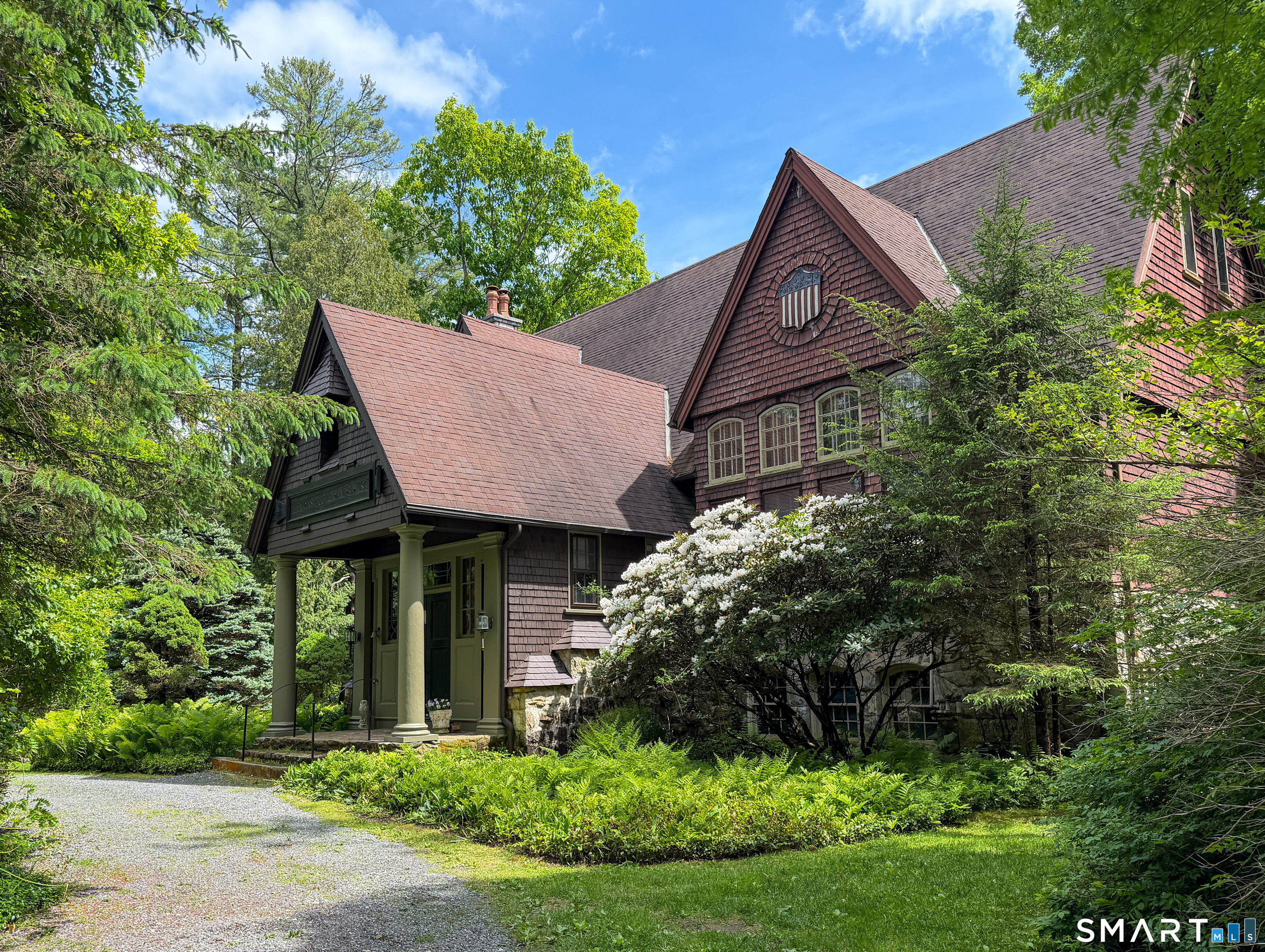 front view of a house with a garden