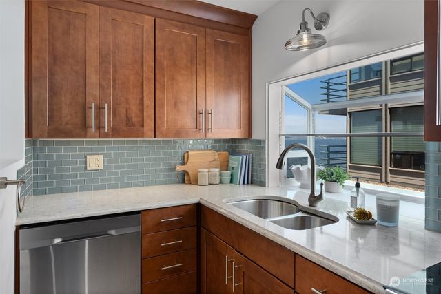 a bed room with a bed couch and a window