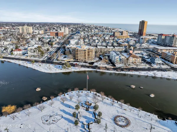 a bathroom with a sink mirror and shower