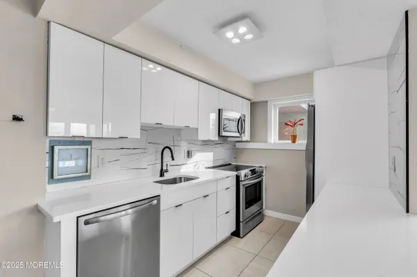 a dining room with furniture a rug and wooden floor