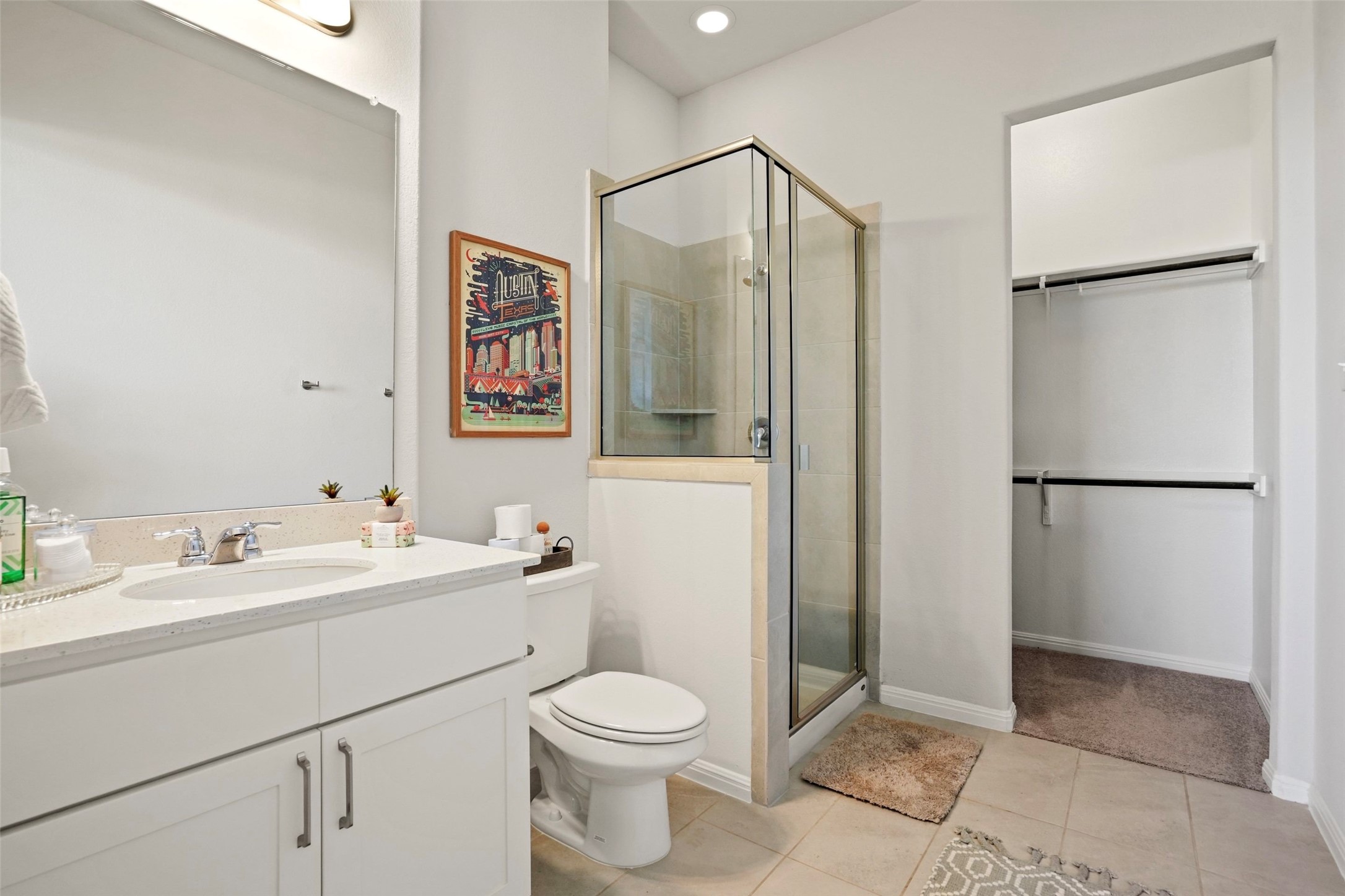 162 Lunar Loop Austin, TX 78737 - Photo 21 of 40 a bathroom with a toilet sink and shower