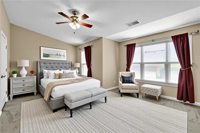 a bedroom with a bed wooden floor and furniture