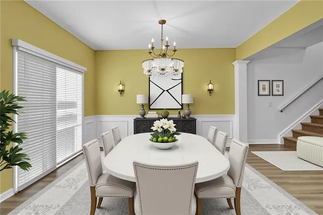 a dining room with furniture and window