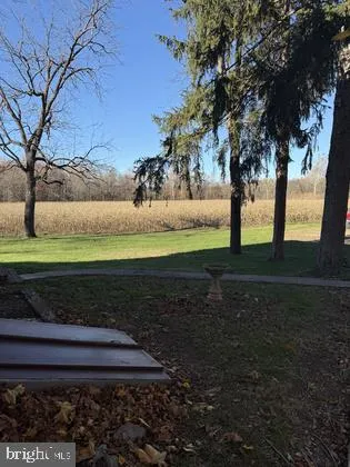 a view of a livingroom with wooden floor and window