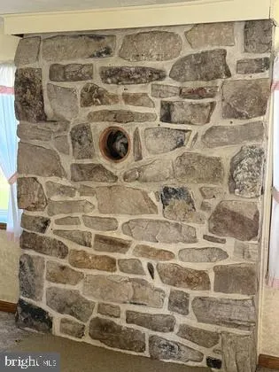 a view of room with stairs and a couch