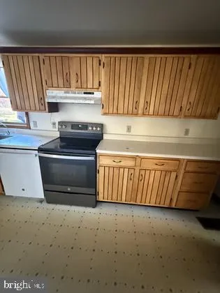 a room with gym equipment and windows