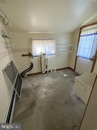 a view of a room with racks on the wall