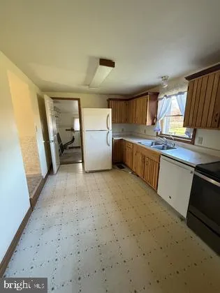 a view of an empty room and a window