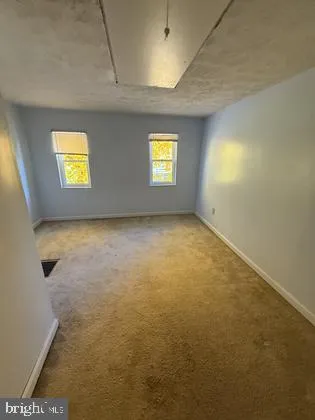a view of a livingroom with furniture and window