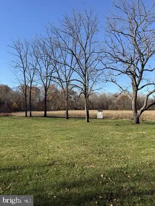 a view of outdoor space with deck and yard