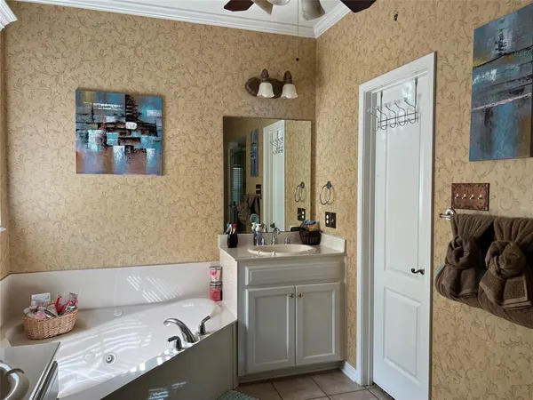 a view of bathroom with a sink and a mirror