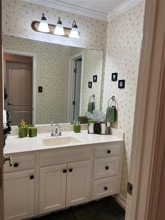 a bathroom with a shower and a sink