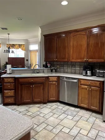 a kitchen with stainless steel appliances granite countertop a sink and cabinets