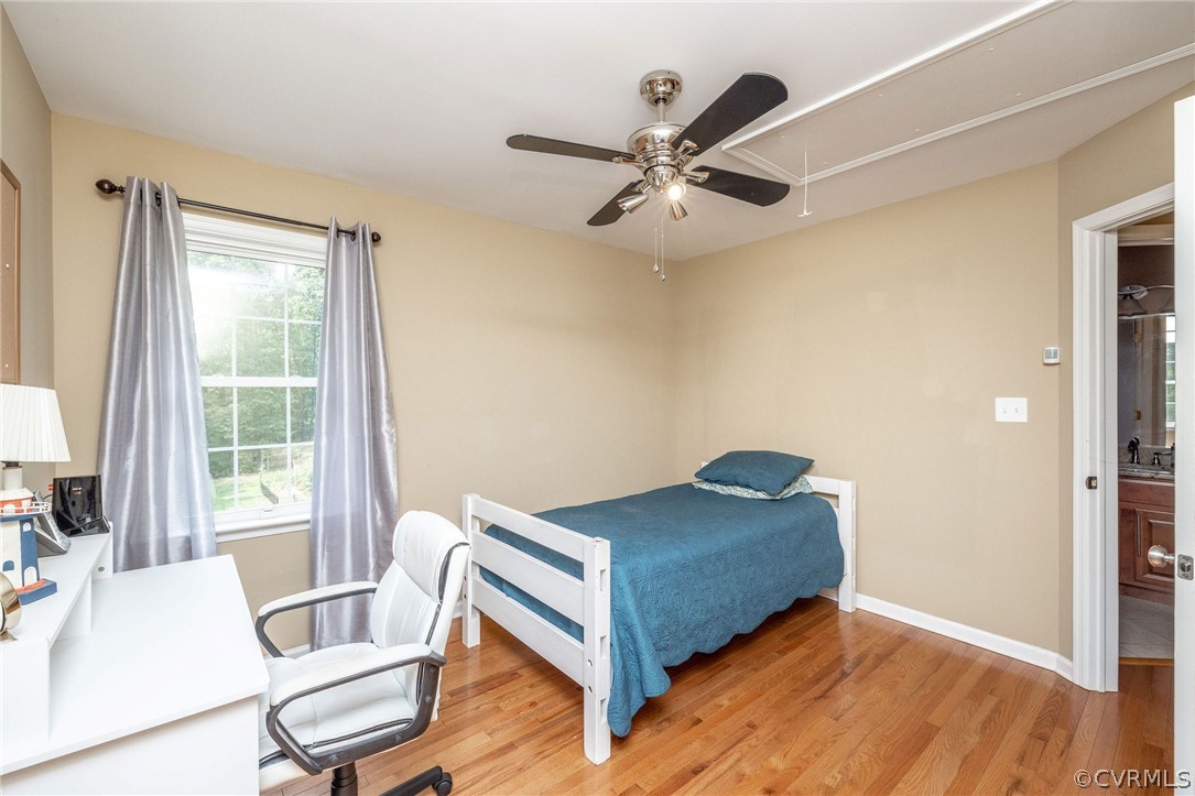 4952 Shannon Road Kents Store, VA 23084 - Photo 21 of 40 a living room with a bed furniture and a large window
