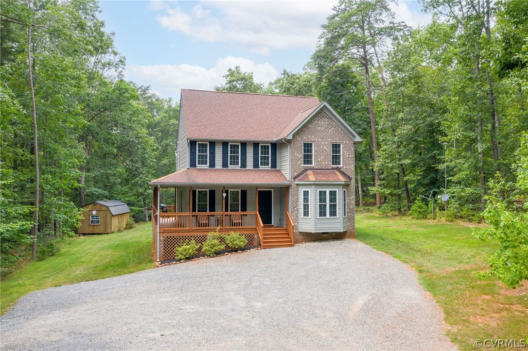 4952 Shannon Road Kents Store, VA 23084 - Photo 40 of 40 a front view of a house with a yard and potted plants