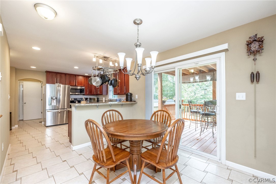 4952 Shannon Road Kents Store, VA 23084 - Photo 7 of 40 a dining room filled counter top space and a chandelier