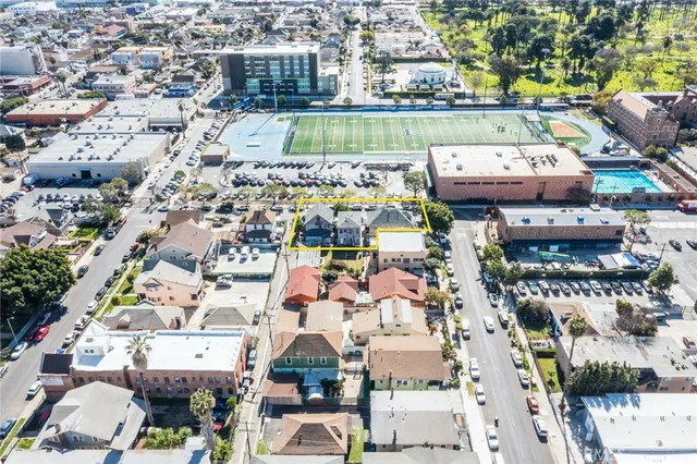 an aerial view of residential houses with outdoor space