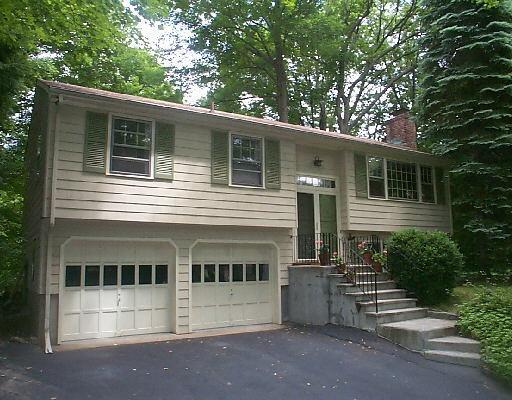 332 Limestone Road Ridgefield, CT 06877 - Photo 1 of 1 a view of a white house with large windows and a tree