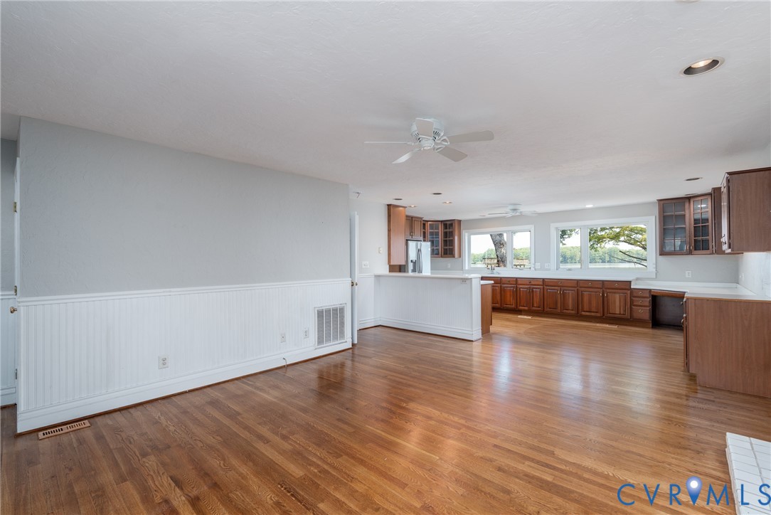 3032 North Riverside Drive Lanexa, VA 23089 - Photo 10 of 33 Open-concept living space featuring wood-finish fl